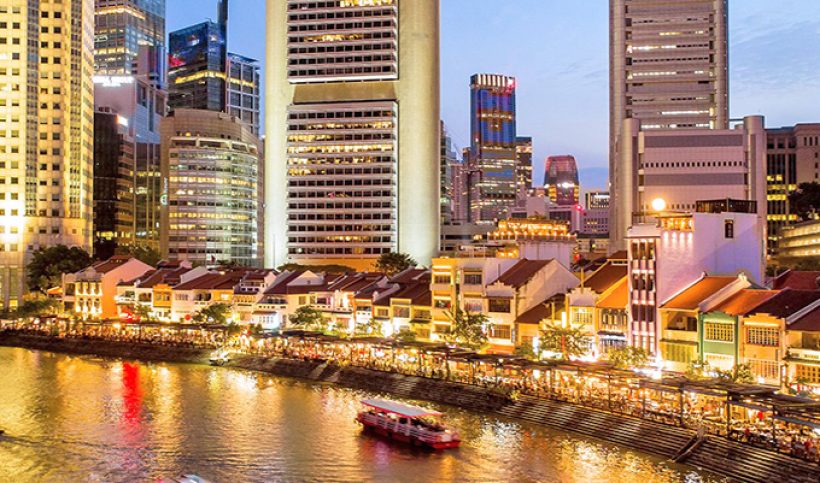 Singapore River at dusk — Boat Quay glittering in the evening light